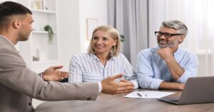 financial planner talking to middle-aged couple