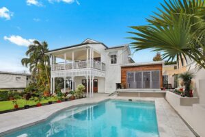 Two-storey coastal home with a swimming pool